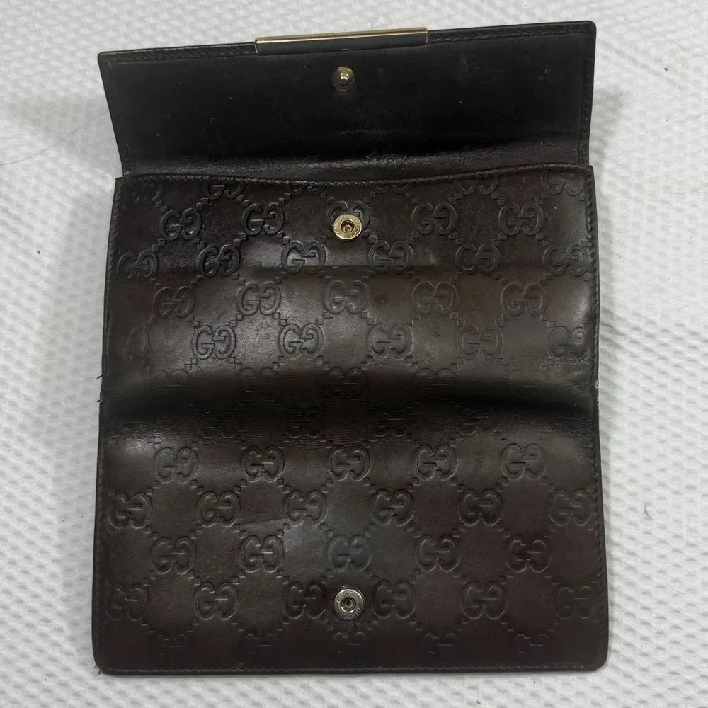 Gucci Dark Brown Embossed Clutch wallet inside is clean. GUC much life left!